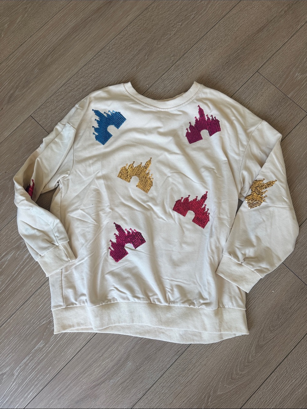 Amazon Cream Sweatshirt with Blue, Magenta and Gold Embroidered Castle Motifs
